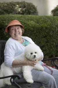 Happy Wesley Woods resident with her dog