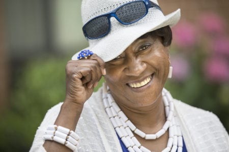 African American Woman with hat and sunglasses